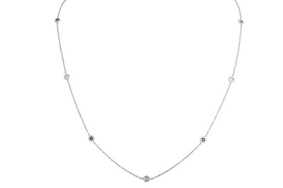 Lot 246 - A DIAMOND AND SAPPHIRE SET CHAIN, the collet...