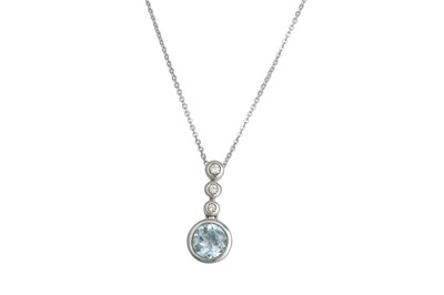 Lot 209 - A DIAMOND AND TOPAZ PENDANT, set with circular...