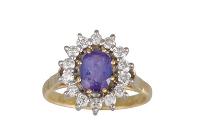 Lot 267 - A TANZANITE AND DIAMOND CLUSTER RING, the...
