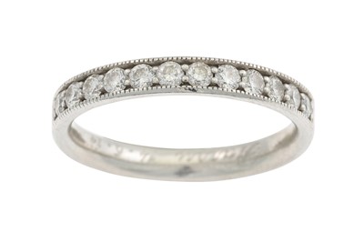Lot 90 - A DIAMOND HALF ETERNITY RING, the brilliant...