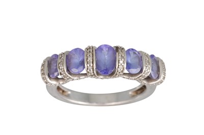 Lot 294 - A TANZANITE AND DIAMOND FIVE STONE RING,...