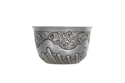 Lot 458 - A GEORGE V SILVER GILT BOWL, with embossed...