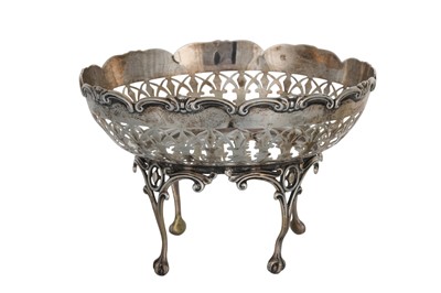 Lot 461 - A GEORGE V SILVER PIERCED TAZZA, of four legs...