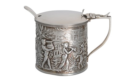 Lot 468 - AN EDWARDIAN SILVER CHASED MUSTARD POT, with...