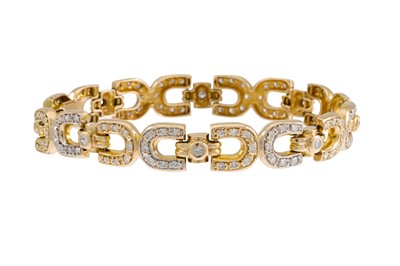 Lot 162 - A DIAMOND SET BRACELET, the horse shoe shaped...