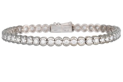 Lot 319 - A DIAMOND LINE BRACELET, by Damiani, the...