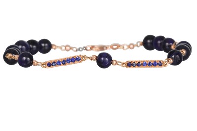 Lot 321 - A SAPPHIRE BRACELET, the circular beads linked...
