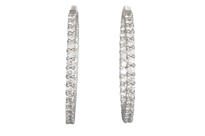 Lot 345 - A PAIR OF DIAMOND HOOP EARRINGS, the brilliant...