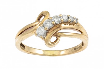 Lot 169 - A DIAMOND RING, of cross over design, mounted...