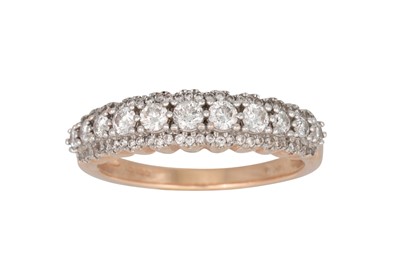 Lot 348 - A DIAMOND THREE ROWED RING, the brilliant cut...