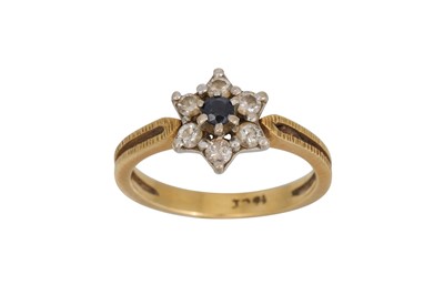 Lot 61 - A DIAMOND AND SAPPHIRE CLUSTER RING, mounted...