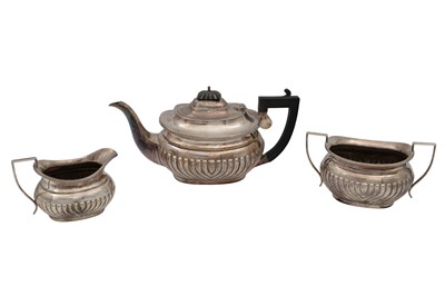 Lot 619 - AN ANTIQUE THREE PIECE SILVER PLATED TEA SET