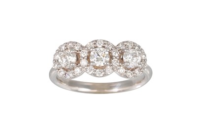 Lot 153 - A DIAMOND TRIPLE CLUSTER RING, the brilliant...