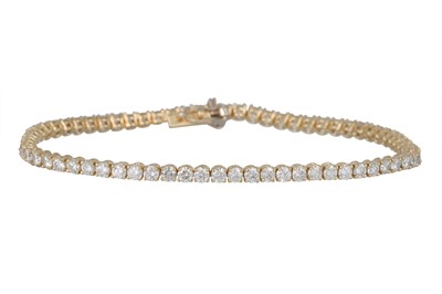 Lot 201 - A DIAMOND LINE BRACELET, the brilliant cut...
