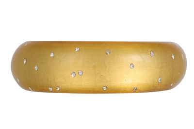 Lot 207 - A RESIN BRACELET, gold leaf decoration