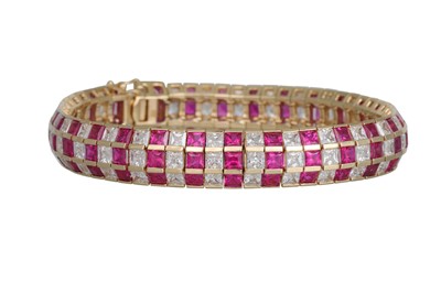 Lot 231 - A STONE SET THREE ROWED BRACELET, set with...