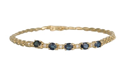 Lot 238 - A SAPPHIRE AND DIAMOND BRACELET, the oval...
