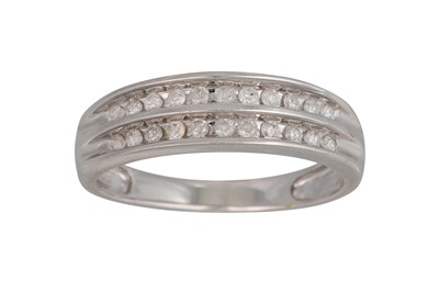 Lot 239 - A TWO ROWED CHANNEL SET DIAMOND RING, in 14ct...