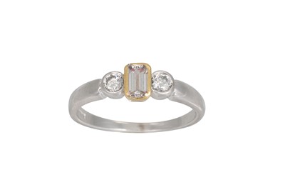 Lot 264 - A THREE STONE DIAMOND RING, the emerald cut...