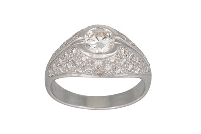Lot 395 - A DIAMOND RING, of bombé form, the brilliant...
