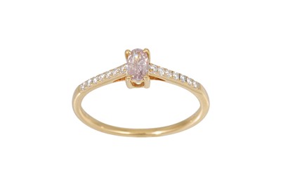 Lot 397 - A PINK DIAMOND RING, the oval stone to diamond...