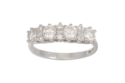 Lot 220 - A FOUR STONE DIAMOND DRESS RING, the round...