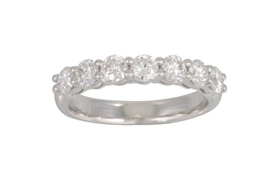 Lot 222 - A DIAMOND HALF ETERNITY RING, the brilliant...