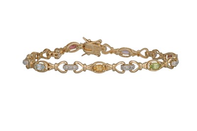 Lot 22 - A MULTI GEM SET BRACELET, set with topaz,...
