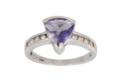 Lot 27 - A TANZANITE AND DIAMOND RING, the trillion cut...