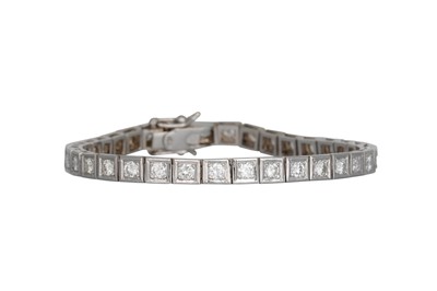 Lot 35 - A DIAMOND LINE BRACELET, the brilliant cut...