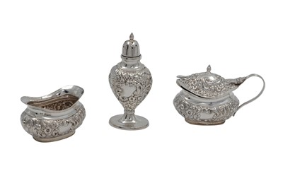 Lot 604 - A MODERN THREE PIECE SILVER EMBOSSED CONDIMENT...