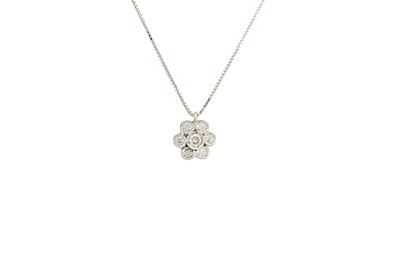 Lot 291 - A DIAMOND CLUSTER PENDANT, the circular...