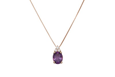 Lot 368 - AN AMETHYST AND DIAMOND PENDANT, the oval...