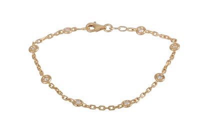 Lot 389 - A DIAMOND BRACELET, the collet set brilliant...