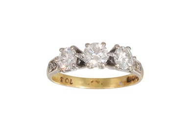 Lot 448 - A THREE STONE DIAMOND RING, the brilliant cut...