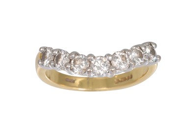 Lot 451 - A SEVEN STONE DIAMOND RING, the brilliant cut...