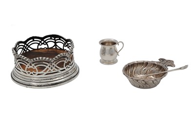 Lot 648 - A SILVER COASTER BOTTLE HOLDER, London 1905,...