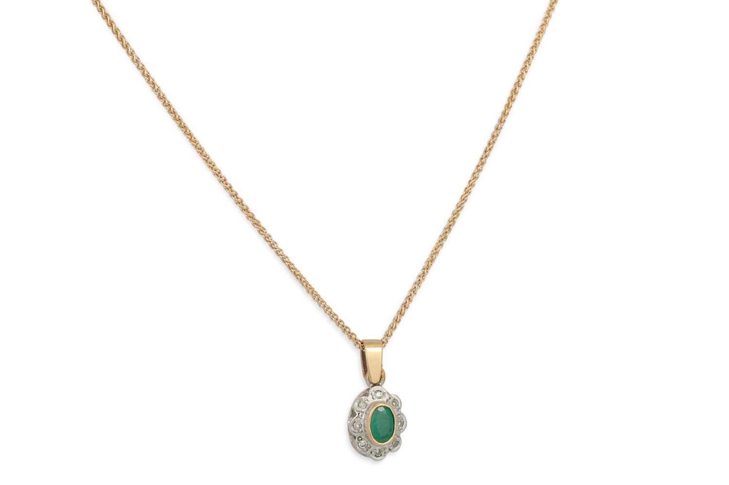 Lot 64 - AN EMERALD AND DIAMOND CLUSTER PENDANT, of...