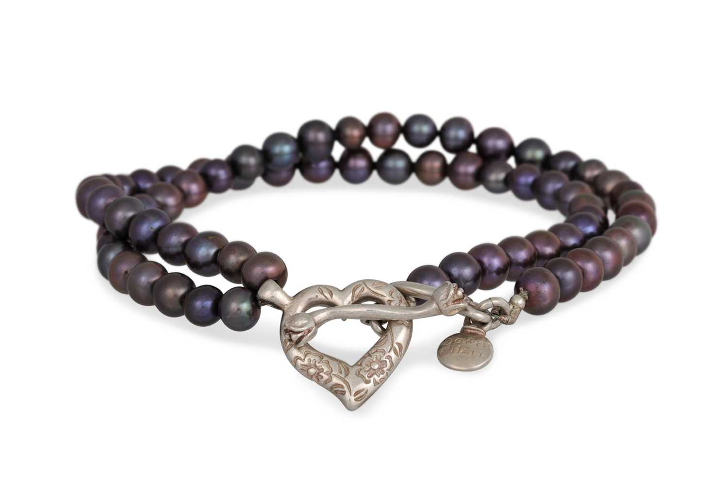 Lot 32 - A BLACK PEARL NECKLACE, with a silver heart...