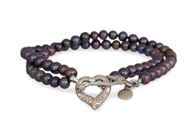 Lot 32 - A BLACK PEARL NECKLACE, with a silver heart...