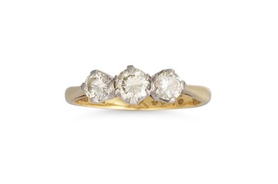 Lot 117 - A THREE STONE DIAMOND RING, the brilliant cut...