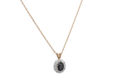 Lot 90 - A DIAMOND AND SAPPHIRE PENDANT, the oval...