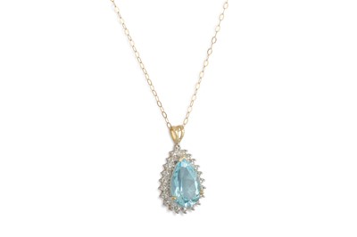 Lot 91 - A TOPAZ AND DIAMOND PENDANT, the pear shaped...