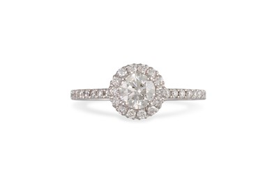 Lot 230 - A DIAMOND 'HALO' CLUSTER RING, the brilliant...