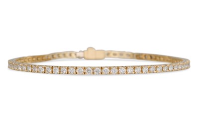 Lot 234 - A DIAMOND LINE BRACELET, the brilliant cut...