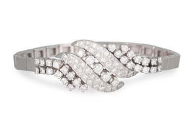 Lot 269 - A DIAMOND COCKTAIL BRACELET, the central cross...
