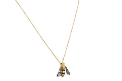 Lot 359 - A BLACK DIAMOND AND GOLD PENDANT, in the form...