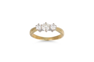 Lot 389 - A THREE STONE DIAMOND RING, the brilliant cut...