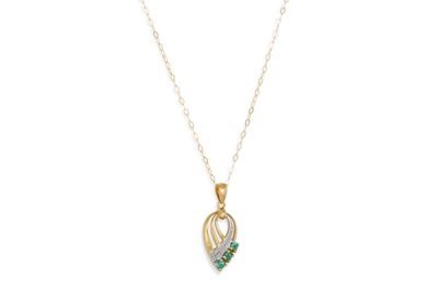 Lot 30 - A DIAMOND AND EMERALD PENDANT, of shaped form,...
