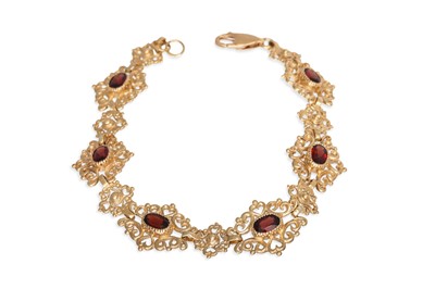 Lot 48 - A GARNET SET BRACELET, of openwork form,...